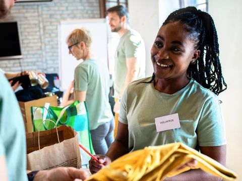 People volunteering donating goods