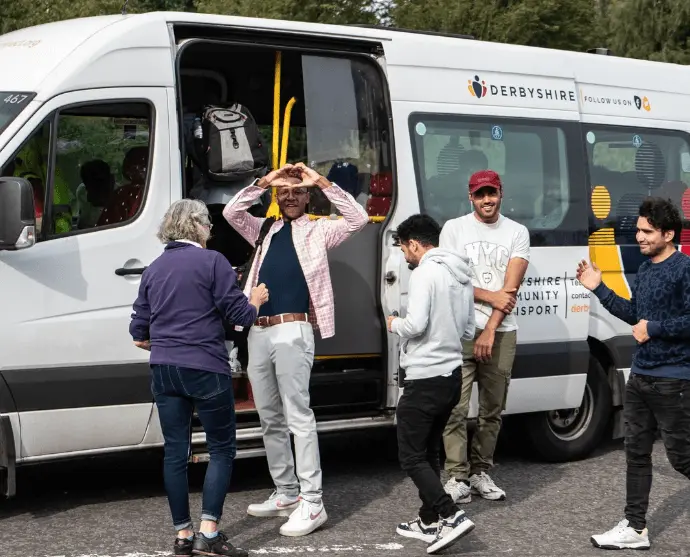 Community transport passengers getting on a bus